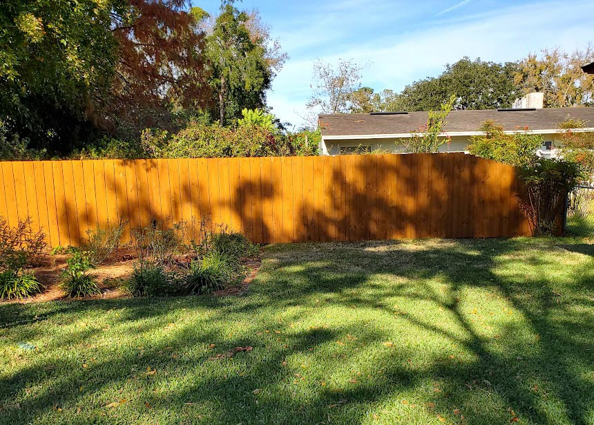 Dark Colored Privacy Fence Downward Slope