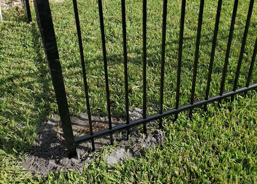 Graded Yard Metal Fence Corner