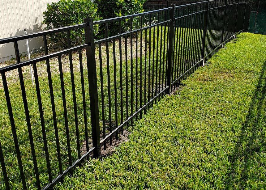 Graded Yard Metal Fence