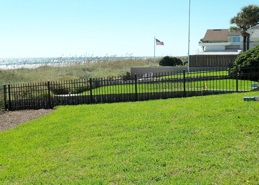 Metal Fence Along The Beach Side View