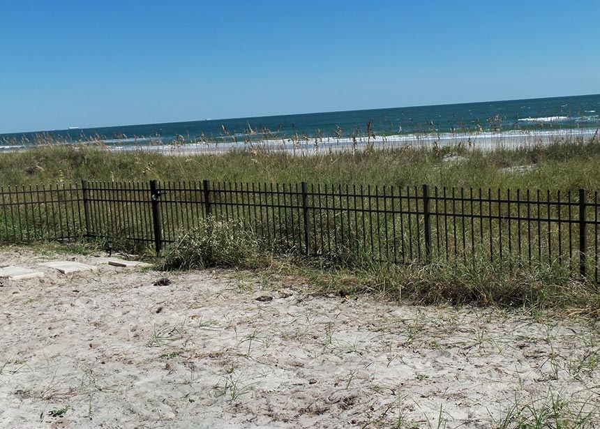 Metal Fence Along The Beach