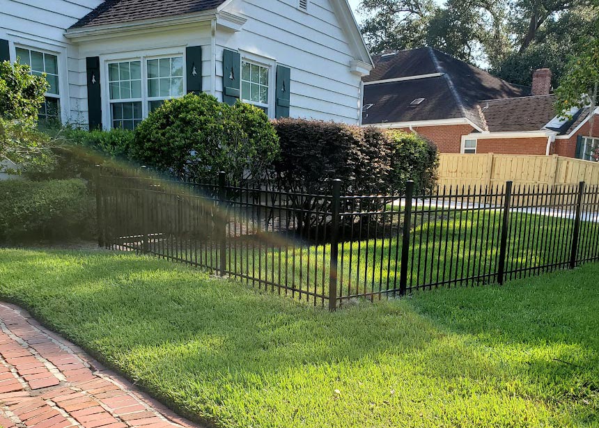 Metal Fence On Front Yard Corner