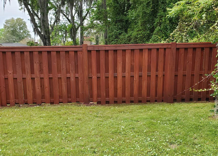 Red Stained Fence Center