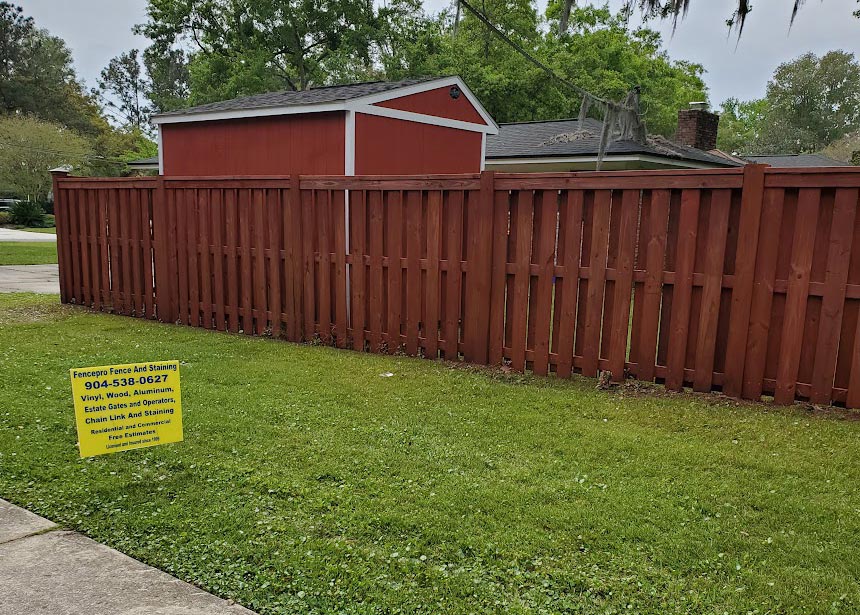 Red Stained Fence Reverse Angle