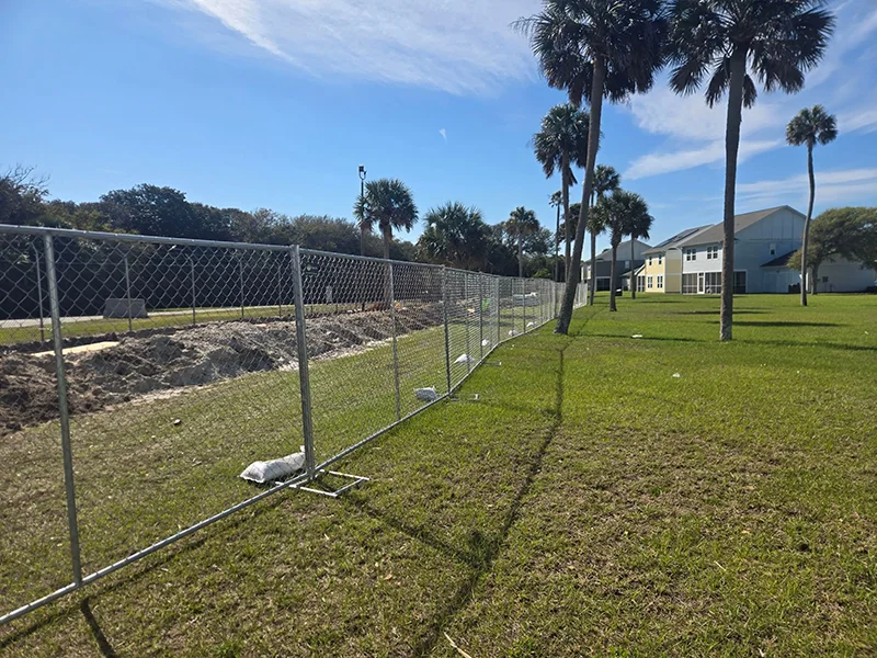 Chain link temporary fencing used to control access at an active worksite
