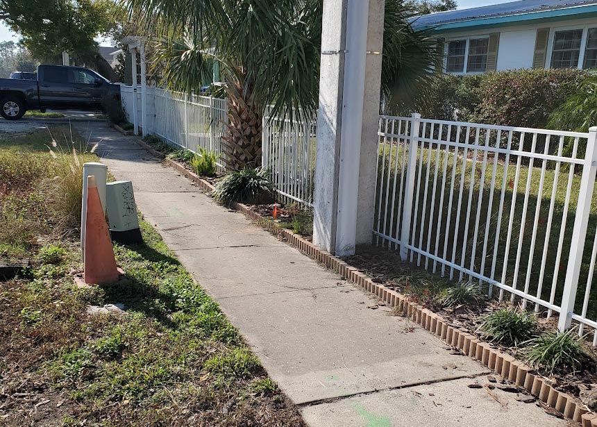 White Metal Fence Along Street