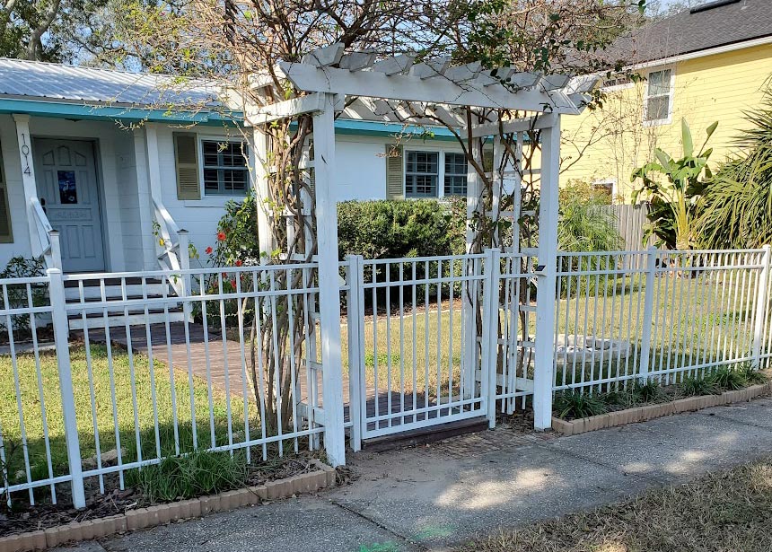 White Metal Fence With Pergola