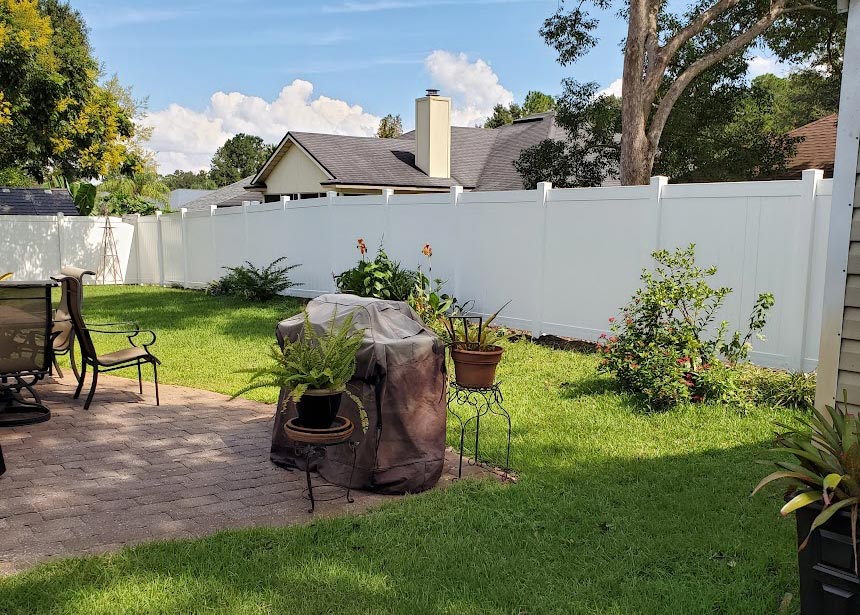 White Vinyl Privacy Fence Around Patio